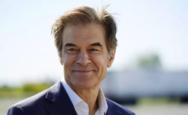 FILE - Mehmet Oz visits the AW Driving School &amp; License Testing Center in Allentown, Pa., Sept. 23, 2022. (AP Photo/Matt Rourke, File)