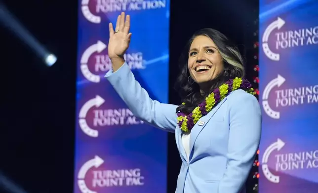 FILE - Former Democratic Rep. Tulsi Gabbard waves as she arrives to speak before Republican presidential nominee former President Donald Trump during a campaign rally at Thomas &amp; Mack Center, Oct. 24, 2024, in Las Vegas. (AP Photo/Alex Brandon, File)