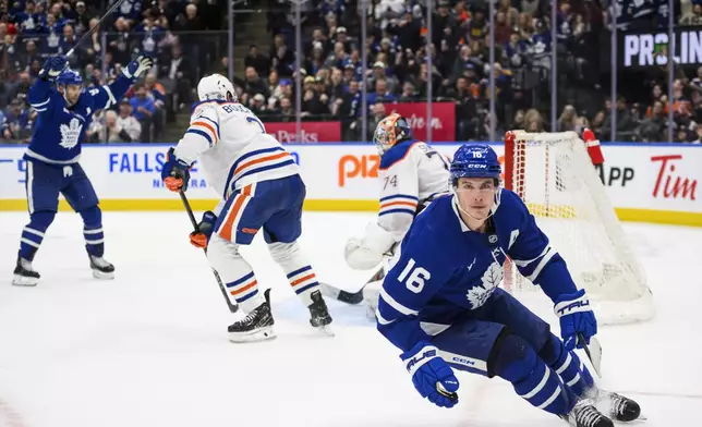 Toronto Maple Leafs right wing Mitch Marner (16) scores during overtime in an NHL hockey game against the Edmonton Oilers, Saturday, Nov. 16, 2024 in Toronto. (Christopher Katsarov/The Canadian Press via AP)