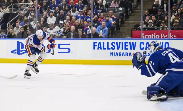 Toronto Maple Leafs goaltender Anthony Stolarz (41) makes a save on Edmonton Oilers right wing Connor Brown (28) during the first period of an NHL hockey game, Saturday, Nov. 16, 2024 in Toronto. (Christopher Katsarov/The Canadian Press via AP)