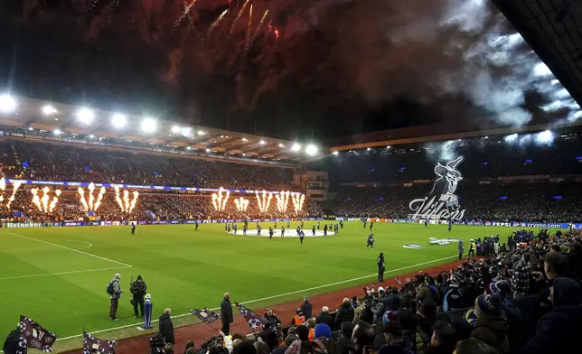 A general view as pyrotechnics are set off during pre-match entertainment before the Champions League opening phase soccer match between Astin Villa and Juventus at Villa Park in Birmingham, England, Wednesday, Nov. 27, 2024. (David Davies/PA via AP)