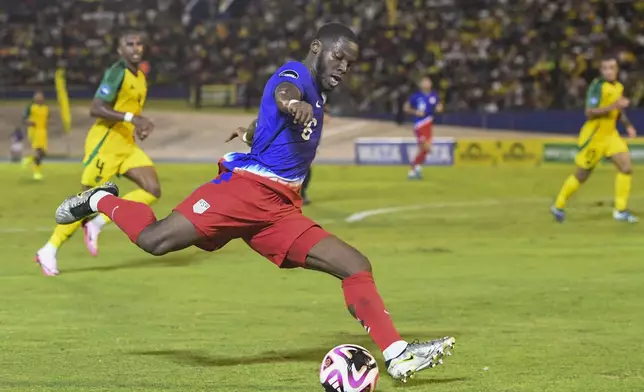 United States' Yunus Musah prepares shoots the ball against Jamaica during a CONCACAF Nations League quarterfinal first leg soccer match in Kingston, Jamaica, Thursday, Nov. 14, 2024. (AP Photo/Collin Reid)