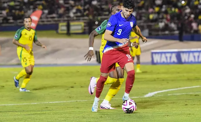 United States' Ricardo Pepi prepares to shoot against Jamaica during a CONCACAF Nations League quarterfinal first leg soccer match in Kingston, Jamaica, Thursday, Nov. 14, 2024. (AP Photo/Collin Reid)