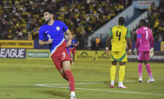 United States' Ricardo Pepi celebrates scoring his side's first goal against Jamaica during a CONCACAF Nations League quarterfinal first leg soccer match in Kingston, Jamaica, Thursday, Nov. 14, 2024. (AP Photo/Collin Reid)