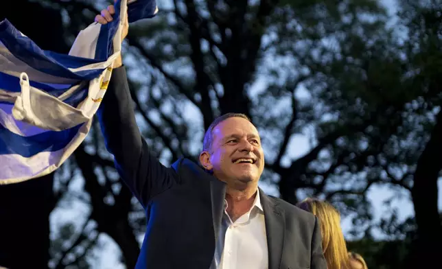 Alvaro Delgado, presidential candidate for the ruling National Party, holds his closing rally ahead of the presidential run-off election in Montevideo, Uruguay, Wednesday, Nov. 20, 2024. (AP Photo/Santiago Mazzarovich)