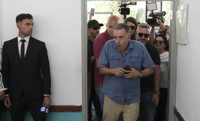 Yamandu Orsi, presidential candidate from the Frente Amplio (Broad Front), arrives to vote in the presidential run-off election in Canelones, Uruguay, Sunday, Nov. 24, 2024. (AP Photo/Matilde Campodonico)