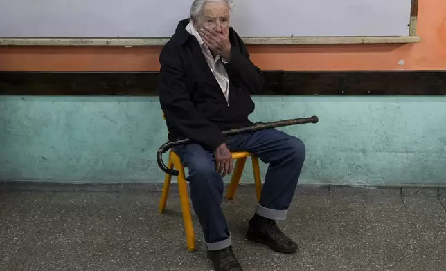 Uruguay's former President Jose "Pepe" Mujica sits inside a polling station while waiting to vote in the presidential run-off election in Montevideo, Uruguay, Sunday, Nov. 24, 2024.(AP Photo/Natacha Pisarenko)