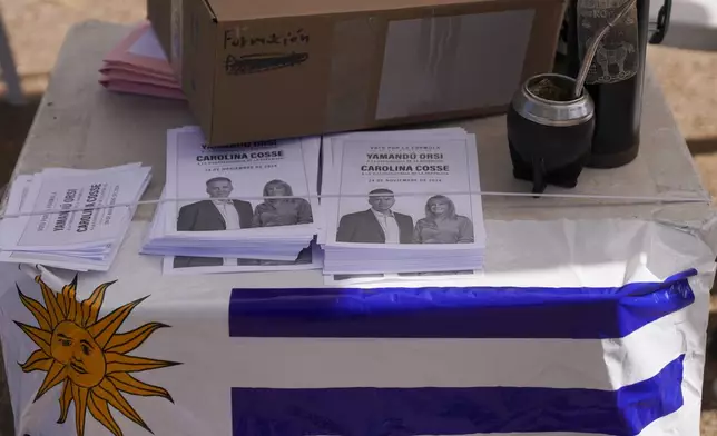 Ballots of Frente Amplio presidential candidate Yamandu Orsi with running mate Carolina Cosse sit on a table outside a polling station in the presidential run-off election in Canelones, Uruguay, Sunday, Nov. 24, 2024. (AP Photo/Matilde Campodonico)