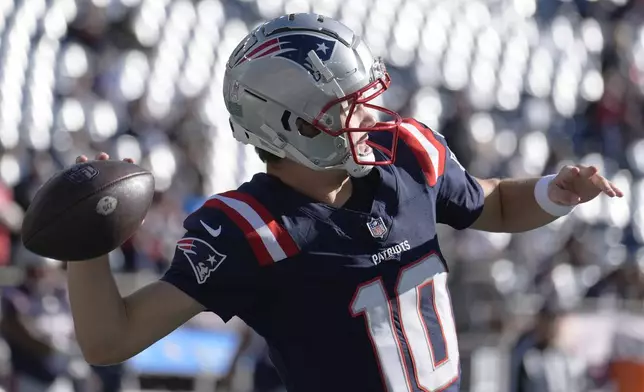 New England Patriots quarterback Drake Maye warms up prior to an NFL football game between the New England Patriots and Los Angeles Rams, Sunday, Nov. 17, 2024, in Foxborough, Mass. (AP Photo/Michael Dwyer)