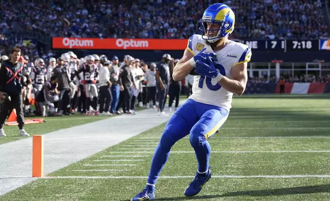 Los Angeles Rams wide receiver Cooper Kupp (10) scores against the New England Patriots during the first half of an NFL football game, Sunday, Nov. 17, 2024, in Foxborough, Mass. (AP Photo/Michael Dwyer)