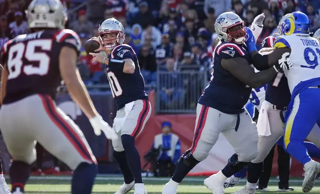 New England Patriots quarterback Drake Maye (10) looks to pass against the Los Angeles Rams during the first half of an NFL football game, Sunday, Nov. 17, 2024, in Foxborough, Mass. (AP Photo/Michael Dwyer)