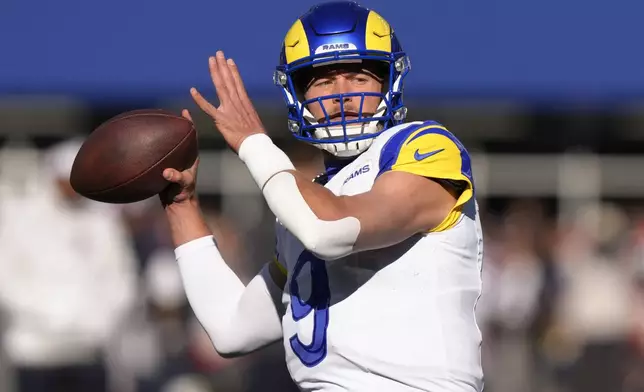 Los Angeles Rams quarterback Matthew Stafford warms up prior to an NFL football game between the New England Patriots and the Rams, Sunday, Nov. 17, 2024, in Foxborough, Mass. (AP Photo/Steven Senne)