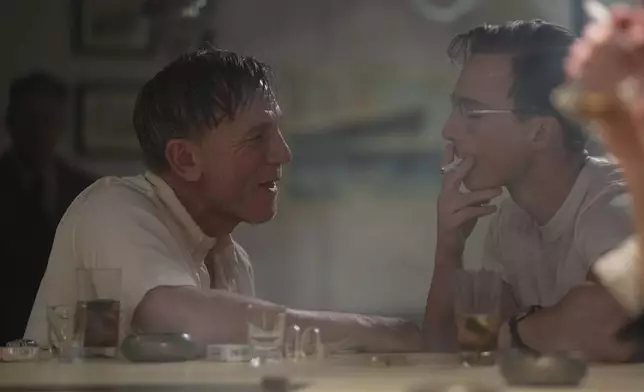 This image released by A24 shows Daniel Craig, left, and Drew Starkey in a scene from "Queer." (Yannis Drakoulidis/A24 via AP)