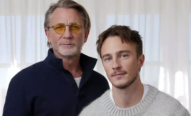 Daniel Craig, left, and Drew Starkey, cast members in the film "Queer," pose together for a portrait to promote the film on Wednesday, Nov. 13, 2024 in Los Angeles. (AP Photo/Chris Pizzello)