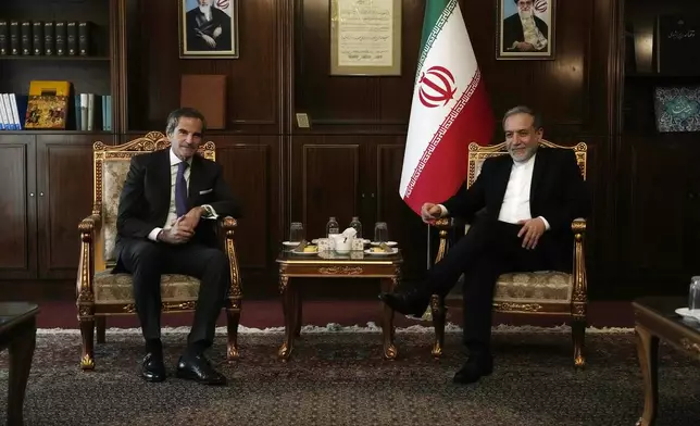 International Atomic Energy Agency (IAEA) Director General Rafael Mariano Grossi, left, meets with Iranian Foreign Minister Abbas Araghchi in Tehran, Iran, Thursday, Nov. 14, 2024. (AP Photo/Vahid Salemi)