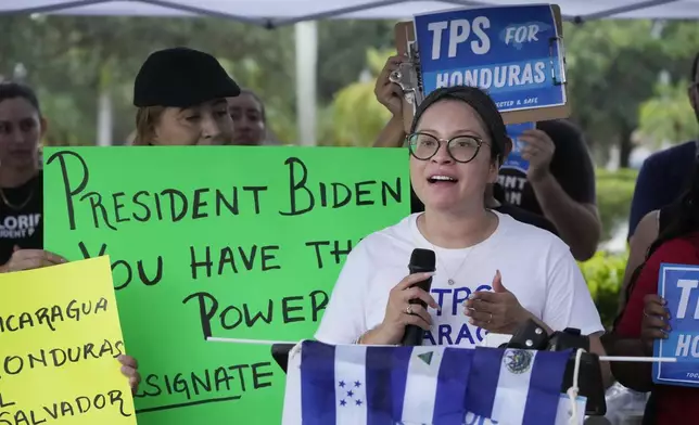 FILE - Yareliz Mendez, 29, with the Florida Immigrant Coalition, speaks during a news conference calling for a new designation of Temporary Protected Status (TPS) for migrants from Nicaragua, El Salvador, and Honduras, in front of the Immigration and Customs Enforcement (ICE) offices, Wednesday, July 26, 2023, in Miramar, Fla. (AP Photo/Wilfredo Lee, File)