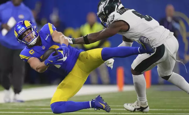 Los Angeles Rams wide receiver Cooper Kupp, left, is tackled by Philadelphia Eagles safety C.J. Gardner-Johnson during the second half of an NFL football game in Inglewood, Calif., Sunday, Nov. 24, 2024. (AP Photo/Mark J. Terrill)