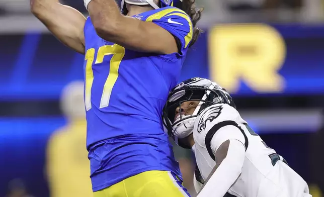 Los Angeles Rams wide receiver Puka Nacua (17) cannot catch a pass as Philadelphia Eagles cornerback Isaiah Rodgers, bottom, is called for pass interference during the second half of an NFL football game in Inglewood, Calif., Sunday, Nov. 24, 2024. (AP Photo/Ryan Sun)