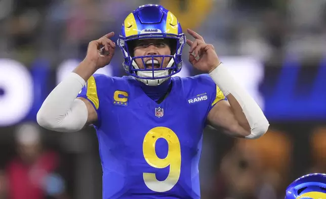 Los Angeles Rams quarterback Matthew Stafford (9) signals at the line of scrimmage during the second half of an NFL football game against the Philadelphia Eagles in Inglewood, Calif., Sunday, Nov. 24, 2024. (AP Photo/Mark J. Terrill)