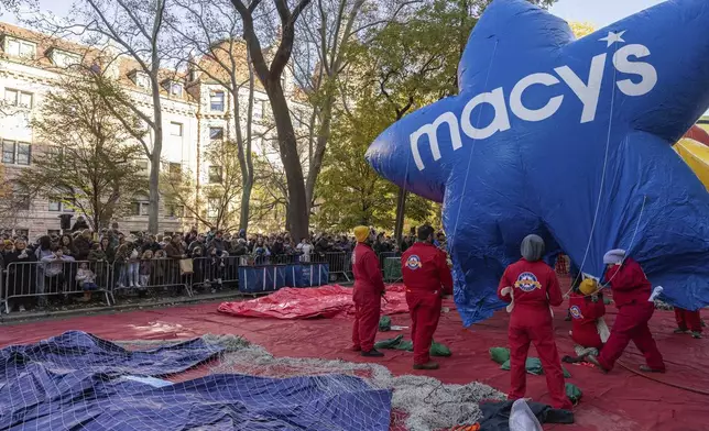 People inflate a float of Macy's Stars in preparation for the Macy's Thanksgiving Day Parade, Wednesday, Nov. 27, 2024, in New York. (AP Photo/Yuki Iwamura)