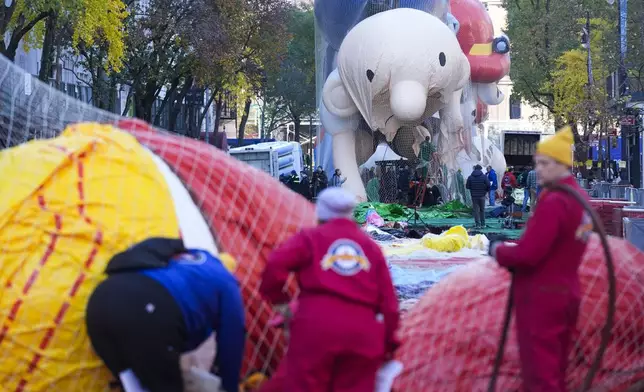 Floats, including a character from "Diary of a Wimpy Kid", are inflated in preparation for the Macy's Thanksgiving Day Parade in New York, Wednesday, Nov. 27, 2024. (AP Photo/Seth Wenig)