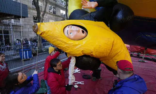 A float featuring a character from the Minions movies is inflated in preparation for the Macy's Thanksgiving Day Parade in New York, Wednesday, Nov. 27, 2024. (AP Photo/Seth Wenig)