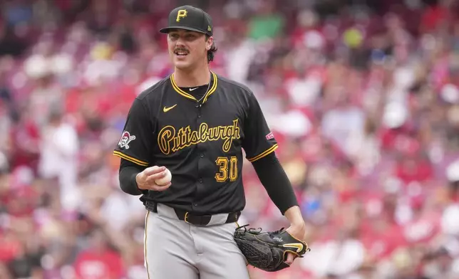 FILE - Pittsburgh Pirates' Paul Skenes resets on the mound before delivering a pitch during the fourth inning of a baseball game against the Cincinnati Reds, Sept. 22, 2024, in Cincinnati. (AP Photo/Kareem Elgazzar, File)