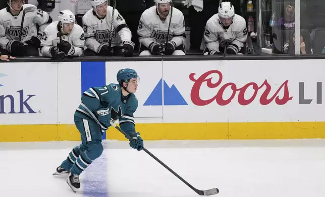 San Jose Sharks center Macklin Celebrini (71) moves the puck during the third period of an NHL hockey game against the Los Angeles Kings, Monday, Nov. 25, 2024, in San Jose, Calif. (AP Photo/Godofredo A. Vásquez)