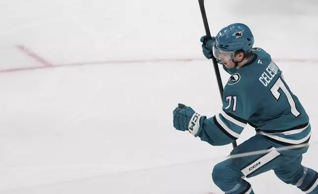 San Jose Sharks center Macklin Celebrini reacts after scoring a goal during the third period of an NHL hockey game against the Los Angeles Kings, Monday, Nov. 25, 2024, in San Jose, Calif. (AP Photo/Godofredo A. Vásquez)