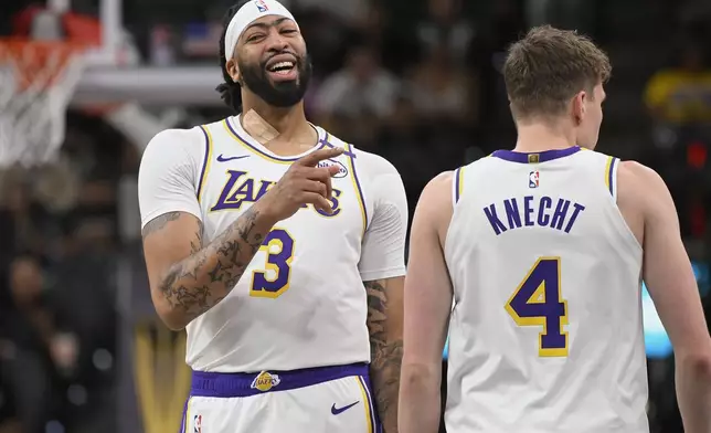 Los Angeles Lakers' Anthony Davis (3) gestures to teammates during the first half of an Emirates NBA Cup basketball game against the San Antonio Spurs, Friday, Nov. 15, 2024, in San Antonio. (AP Photo/Darren Abate)