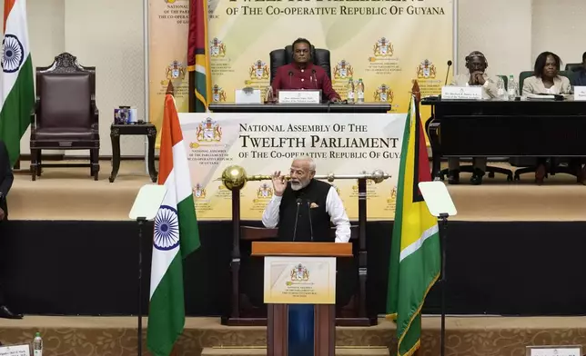 India's Prime Minister Narendra Modi addresses members of Parliament, in Georgetown, Guyana, Thursday, Nov. 21, 2024. (AP Photo/Matias Delacroix)