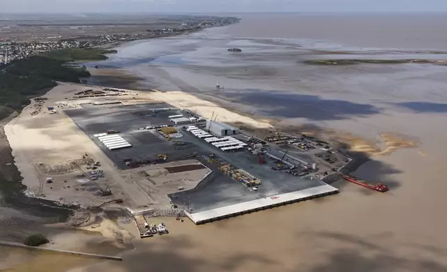 A port that will support offshore oil production is under construction near the mouth of the Demerara River in Georgetown, Guyana, Tuesday, Nov. 19, 2024. (AP Photo/Matias Delacroix)