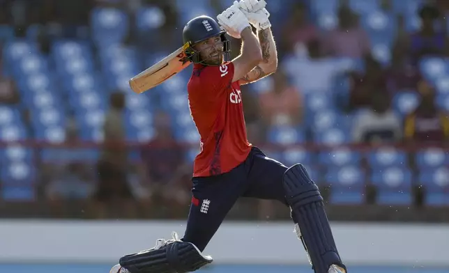 England's Phil Salt plays a shot for six runs against West Indies during the fourth T20 cricket match at Daren Sammy National Cricket Stadium in Gros Islet, St. Lucia, Saturday, Nov. 16, 2024. (AP Photo/Ricardo Mazalan)