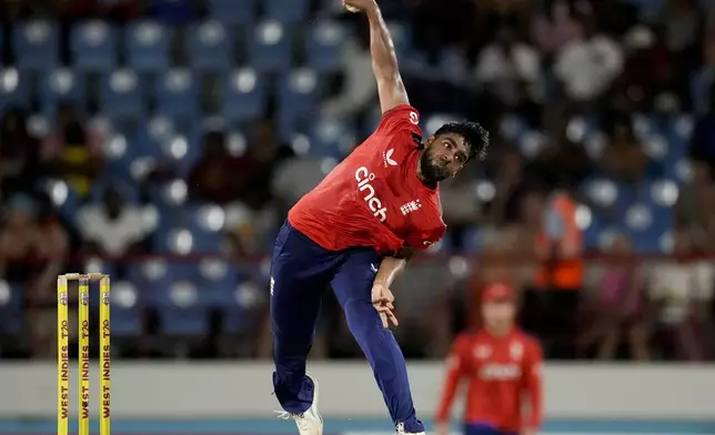 England's Rehan Ahmed bowls against West Indies during the fourth T20 cricket match at Daren Sammy National Cricket Stadium in Gros Islet, St. Lucia, Saturday, Nov. 16, 2024. (AP Photo/Ricardo Mazalan)