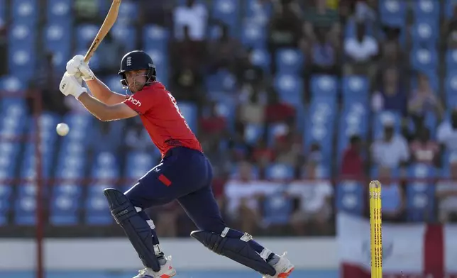 England's Will Jacks plays a shot from the bowling of West Indies' Obed McCoy during the fourth T20 cricket match at Daren Sammy National Cricket Stadium in Gros Islet, St. Lucia, Saturday, Nov. 16, 2024. (AP Photo/Ricardo Mazalan)