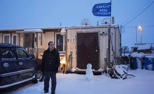 FILE- Charles Lampe, president of the Kaktovik Inupiat Corporation and a city council member, poses for a portrait outside his home, Wednesday, Oct. 16, 2024, in Kaktovik, Alaska. (AP Photo/Lindsey Wasson, File)