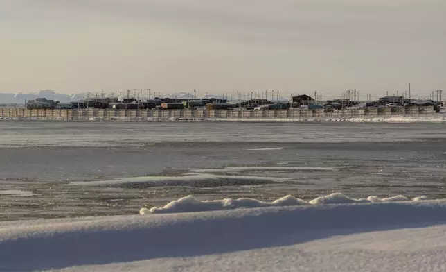 The village of Kaktovik is seen from across the waters of Pipsuk Bight, Tuesday, Oct. 15, 2024, in Kaktovik, Alaska. (AP Photo/Lindsey Wasson)