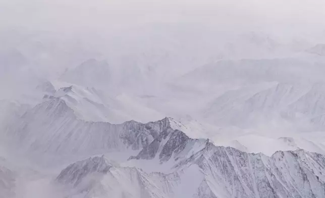 Snow covers the mountains of the Brooks Range in the Arctic National Wildlife Refuge, Monday, Oct. 14, 2024, near Kaktovik, Alaska. (AP Photo/Lindsey Wasson)