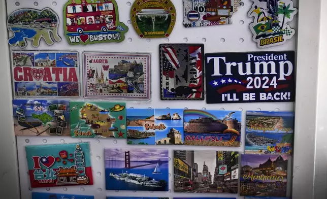 A fridge magnet that reads "President Donald Trump 2024" is displayed at a store at the Yiwu wholesale market in Yiwu, east China's Zhejiang province, Nov. 8, 2024. (AP Photo/Andy Wong)