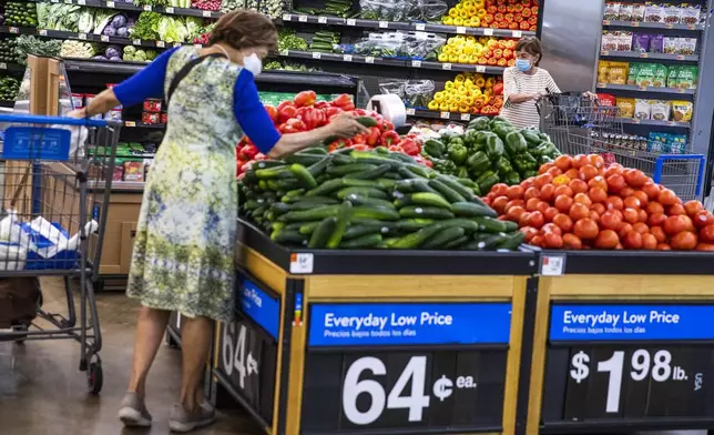 FILE - People buy groceries at a Walmart Superstore in Secaucus, New Jersey, July 11, 2024. (AP Photo/Eduardo Munoz Alvarez, File)