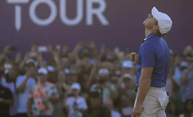 Rory McIlroy of Northern Ireland reacts after winning the World Tour Golf Championship in Dubai, United Arab Emirates, Sunday, Nov. 17, 2024. (AP Photo/Altaf Qadri)