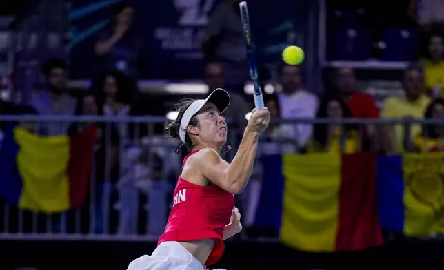 Japan's Ena Shibahara returns the ball against Romania's Jaqueline Cristian during the Billie Jean King Cup Finals, at the Martin Carpena Sports Hall, in Malaga, southern Spain, on Thursday, Nov. 14, 2024. (AP Photo/Manu Fernandez)