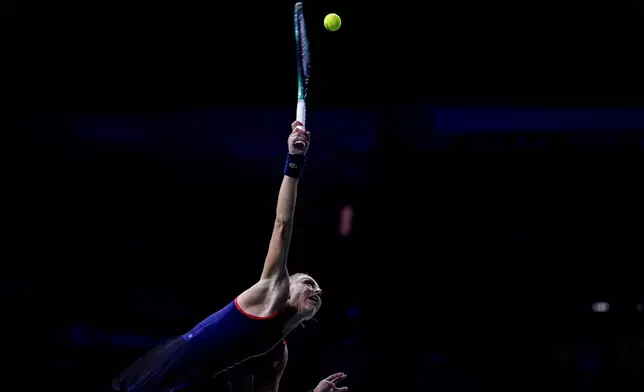 Romania's Jaqueline Cristian serves against Japan's Ena Shibahara during the Billie Jean King Cup Finals, at the Martin Carpena Sports Hall, in Malaga, southern Spain, on Thursday, Nov. 14, 2024. (AP Photo/Manu Fernandez)