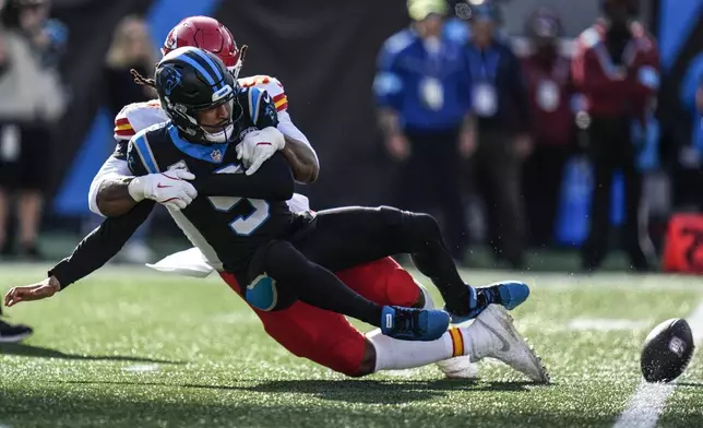 Carolina Panthers quarterback Bryce Young (9) is sacked by the Kansas City Chiefs defense during the first half of an NFL football game, Sunday, Nov. 24, 2024, in Charlotte, N.C. (AP Photo/Rusty Jones)