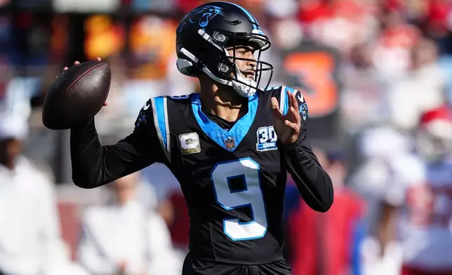 Carolina Panthers quarterback Bryce Young (9) works in the pocket during the first half of an NFL football game against the Kansas City Chiefs, Sunday, Nov. 24, 2024, in Charlotte, N.C. (AP Photo/Jacob Kupferman)