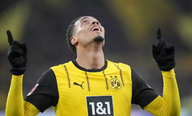 Dortmund's Felix Nmecha celebrates after scoring during the German Bundesliga soccer match between Borussia Dortmund and SC Freiburg at the Signal-Iduna Park in Dortmund, Germany, Saturday, Nov. 23, 2024. (AP Photo/Martin Meissner)