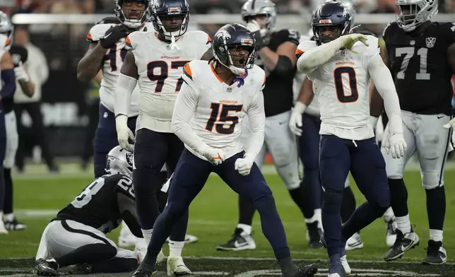 Denver Broncos linebacker Nik Bonitto (15) celebrates a tackle for a loss against the Las Vegas Raiders during the second half of an NFL football game, Sunday, Nov. 24, 2024, in Las Vegas. (AP Photo/John Locher)