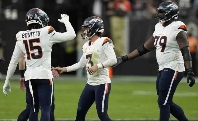 Denver Broncos place kicker Wil Lutz (3) celebrates his field goal during the first half of an NFL football game against the Las Vegas Raiders, Sunday, Nov. 24, 2024, in Las Vegas. (AP Photo/John Locher)