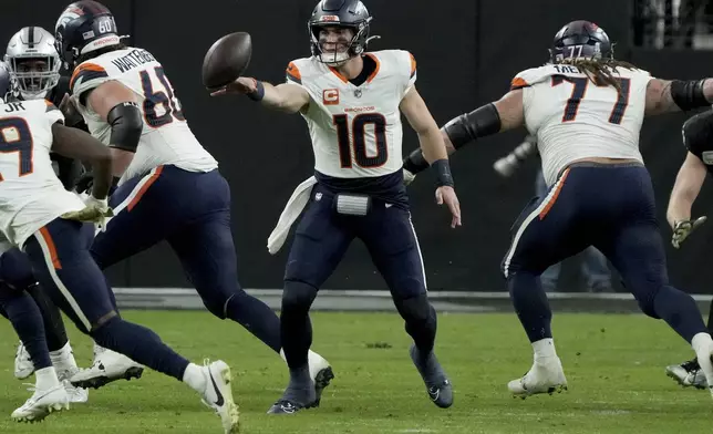 Denver Broncos quarterback Bo Nix (10) throws the ball against the Las Vegas Raiders during the second half of an NFL football game, Sunday, Nov. 24, 2024, in Las Vegas. (AP Photo/Rick Scuteri)