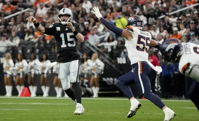 Las Vegas Raiders quarterback Gardner Minshew (15) throws against the Denver Broncos during the first half of an NFL football game, Sunday, Nov. 24, 2024, in Las Vegas. (AP Photo/Rick Scuteri)